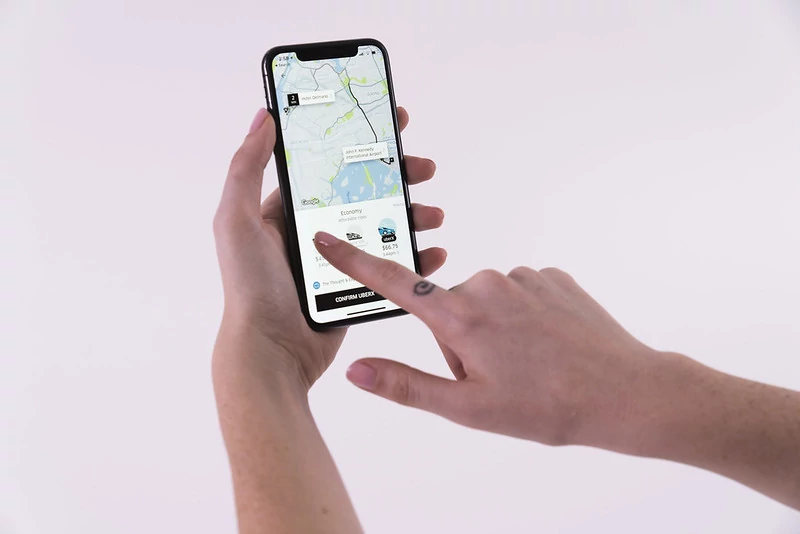 Customer reserving a car on Uber.